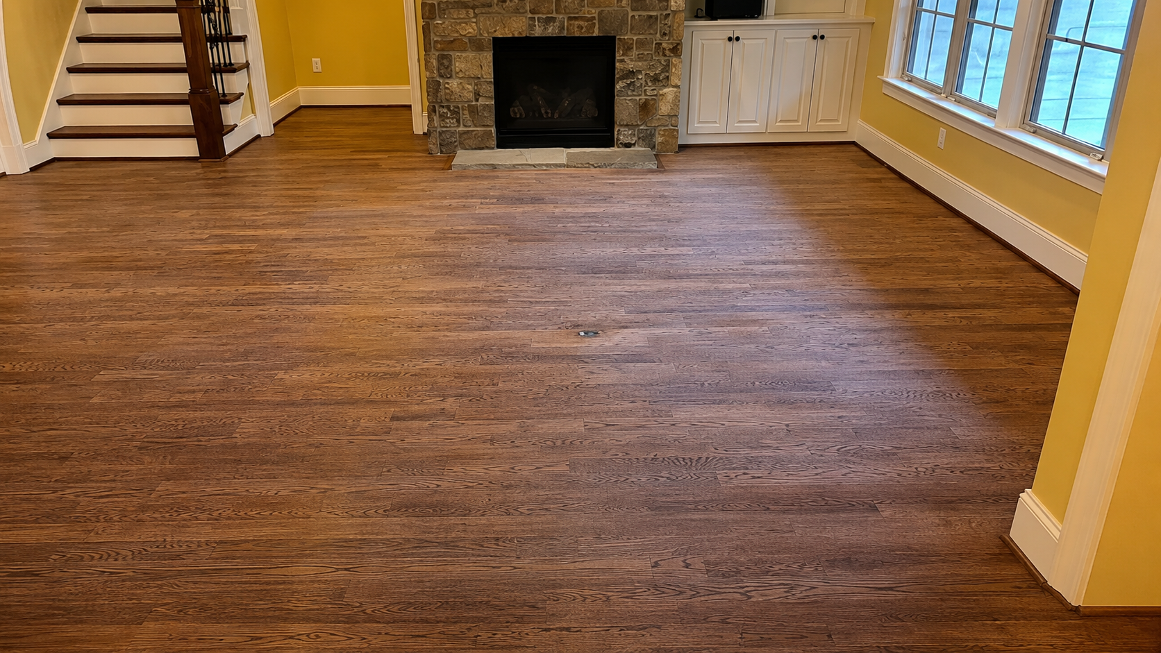 Apex living room hardwood floor before refinishing
